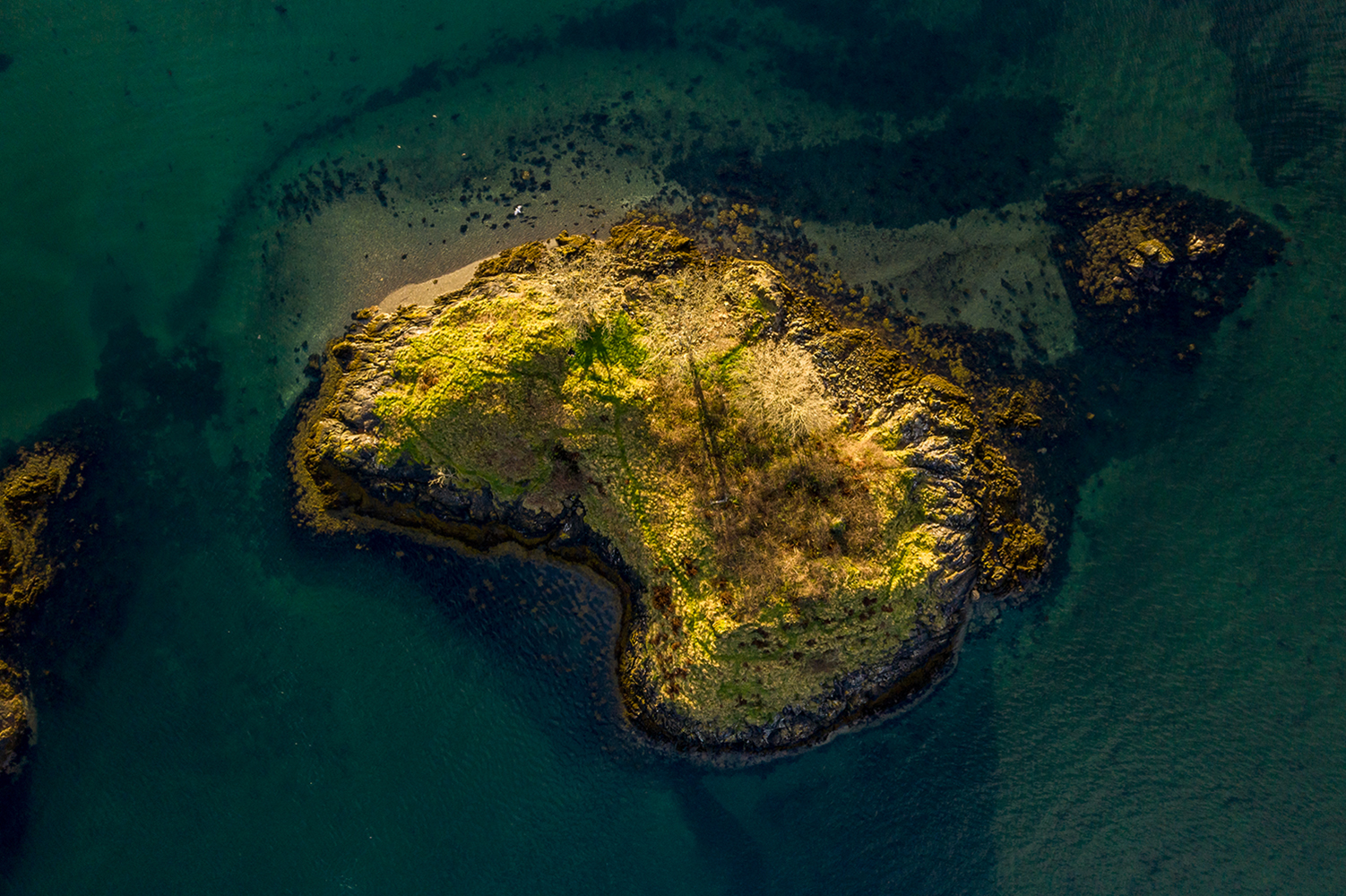best drone photos top down view of an small island in scotland