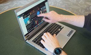 A pair of hands interacting with an Acer Chromebook 514.