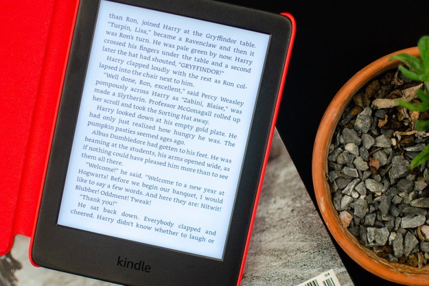 An Amazon Kindle 2019 model sits outside with text on its display.