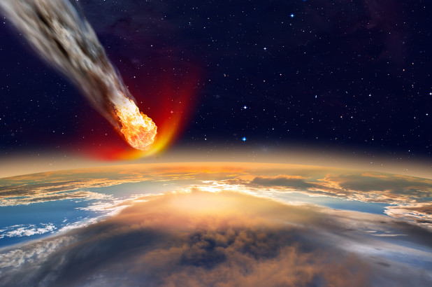 una representación artística de un asteroide que se dirige hacia la Tierra