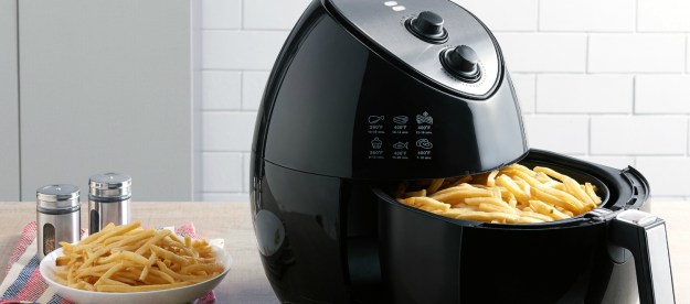 The 3.2-quart Farberware air fryer with fries in the open basket.
