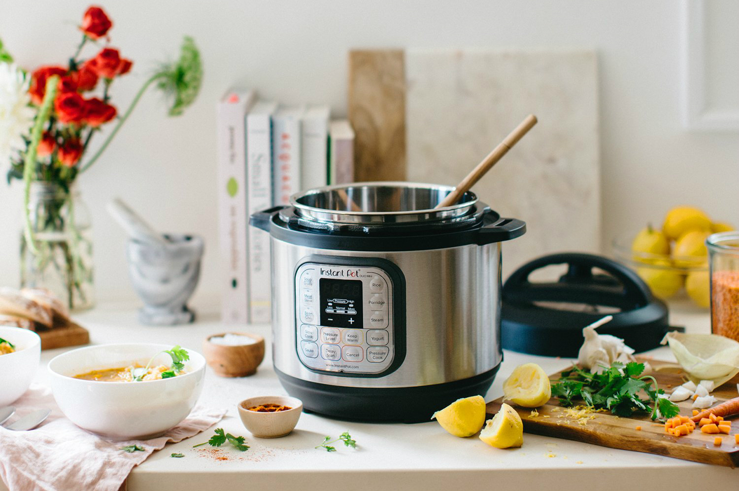 Instant Pot Duo Mini 2 pressure cooker on kitchen counter.