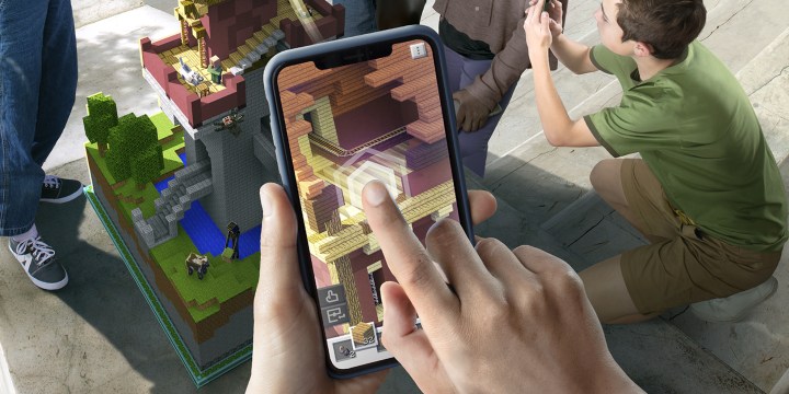 Playing Minecraft Earth on a phone (key art)