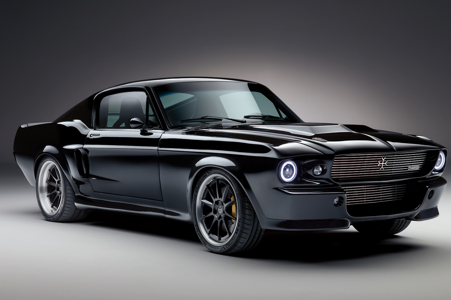 charge cars makes an electric 1960s ford mustang  brand new 1967 fastback 05