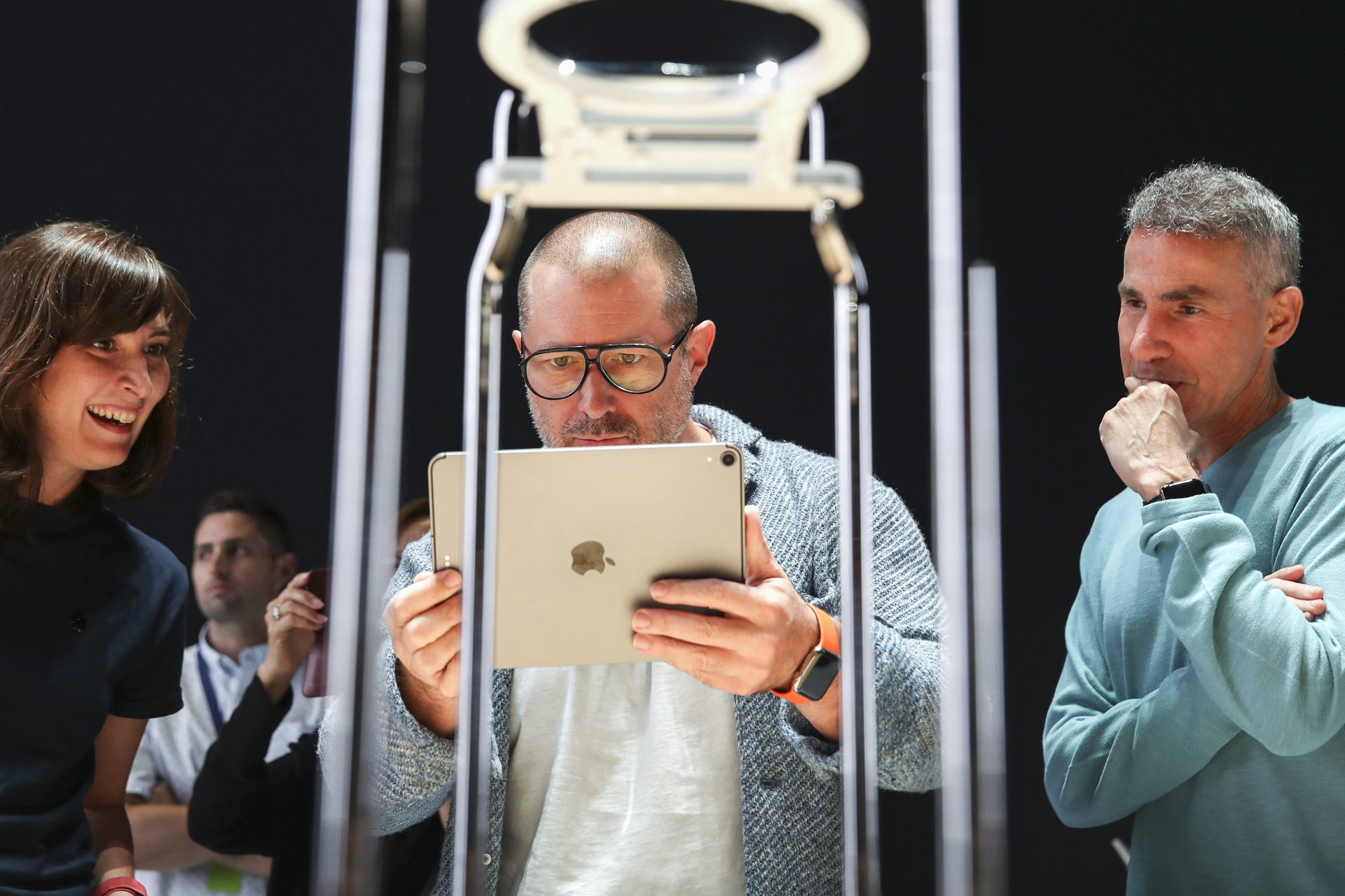 Apple chief design officer Jony Ive (middle) tests out a product at the 2019 Apple Worldwide Developer Conference.