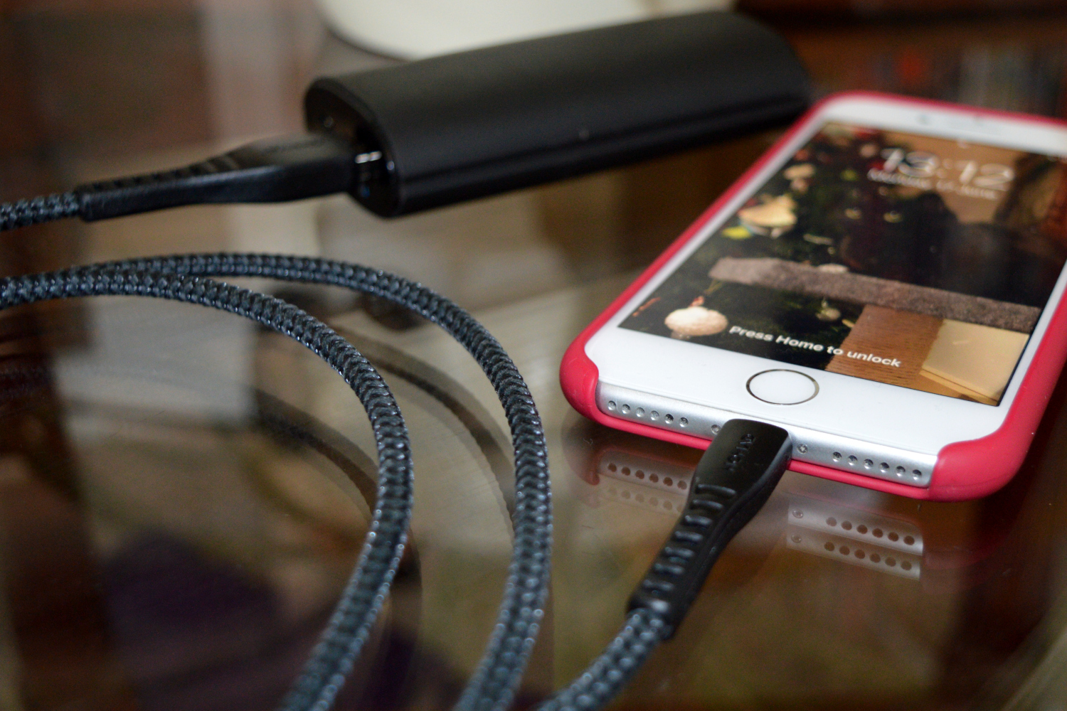 Close-up a lightning cable while an iPhone charges. 
