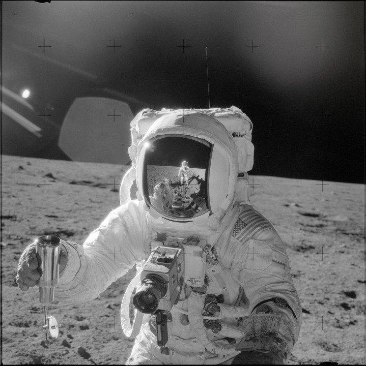 Astronaut Alan L. Bean on the moon while holding the Hasselblad 500EL Data Camera