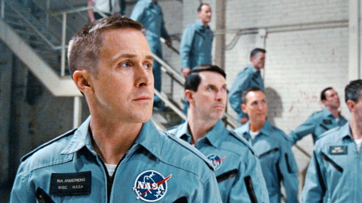 A group of astronauts led by Ryan Gosling stare in the distance.