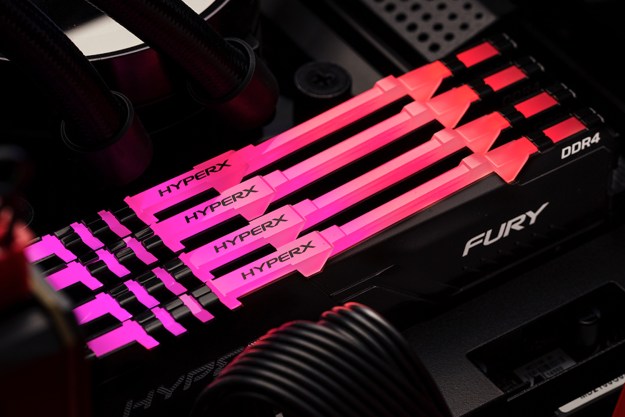 Four DDR4 RAM kits with pink RGB lighting are shown installed inside a PC case.