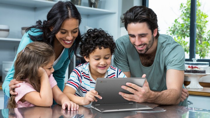 A family looking at the Acer Chromebook Spin 311.