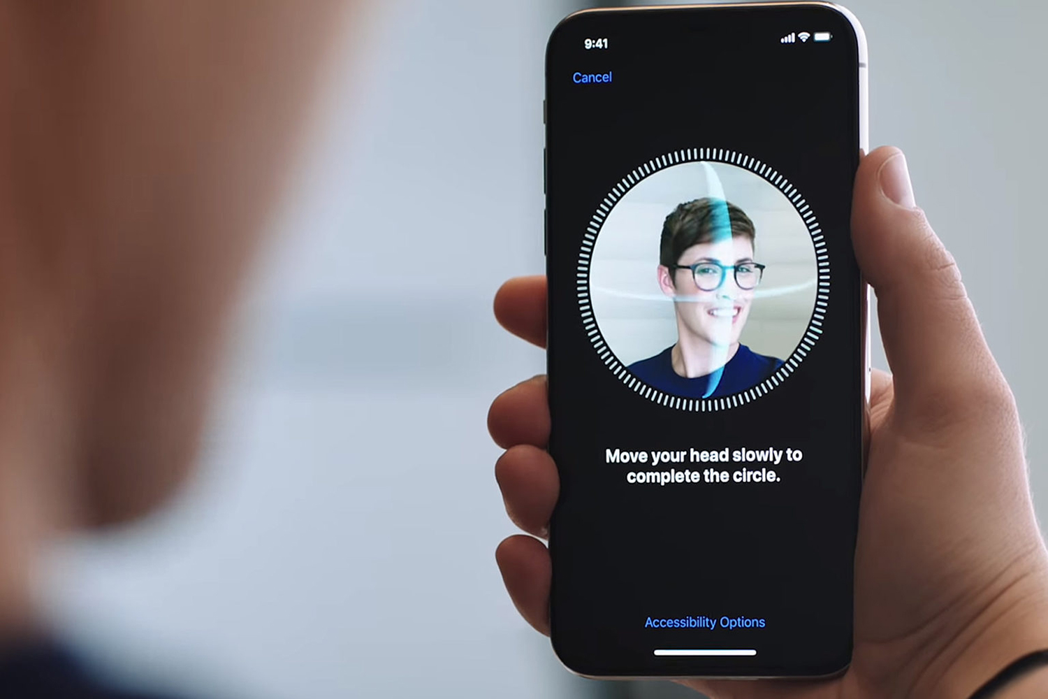 person using face id from iphone