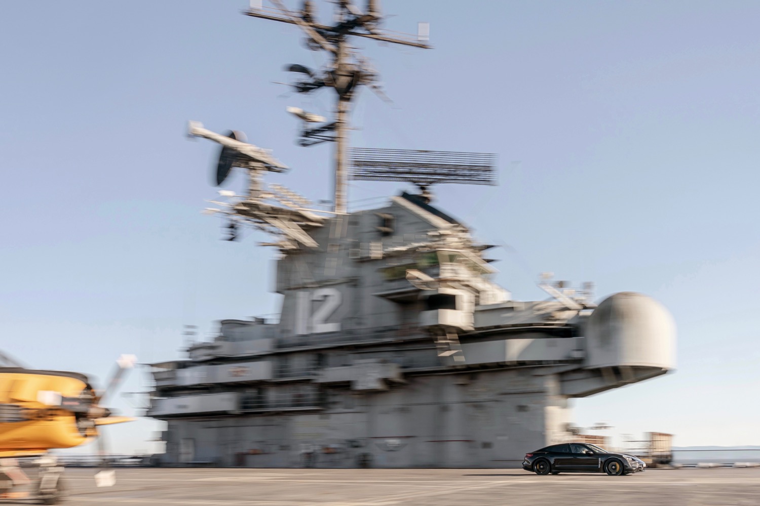 porsche taycan electric car acceleration test on aircraft carrier deck prototype
