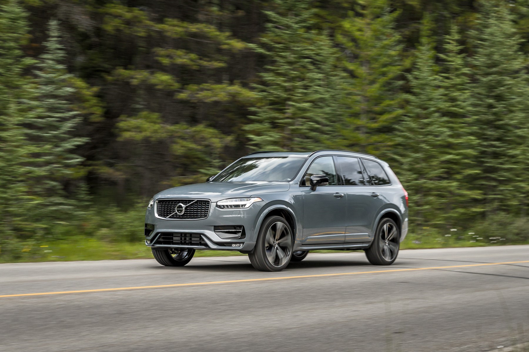A grey 2020 Volvo XC90-R driving on a road.