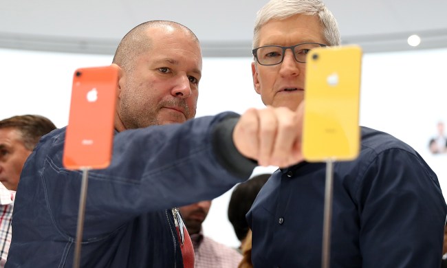 Apple chief design officer Jony Ive (L) and Apple CEO Tim Cook inspect the new iPhone XR