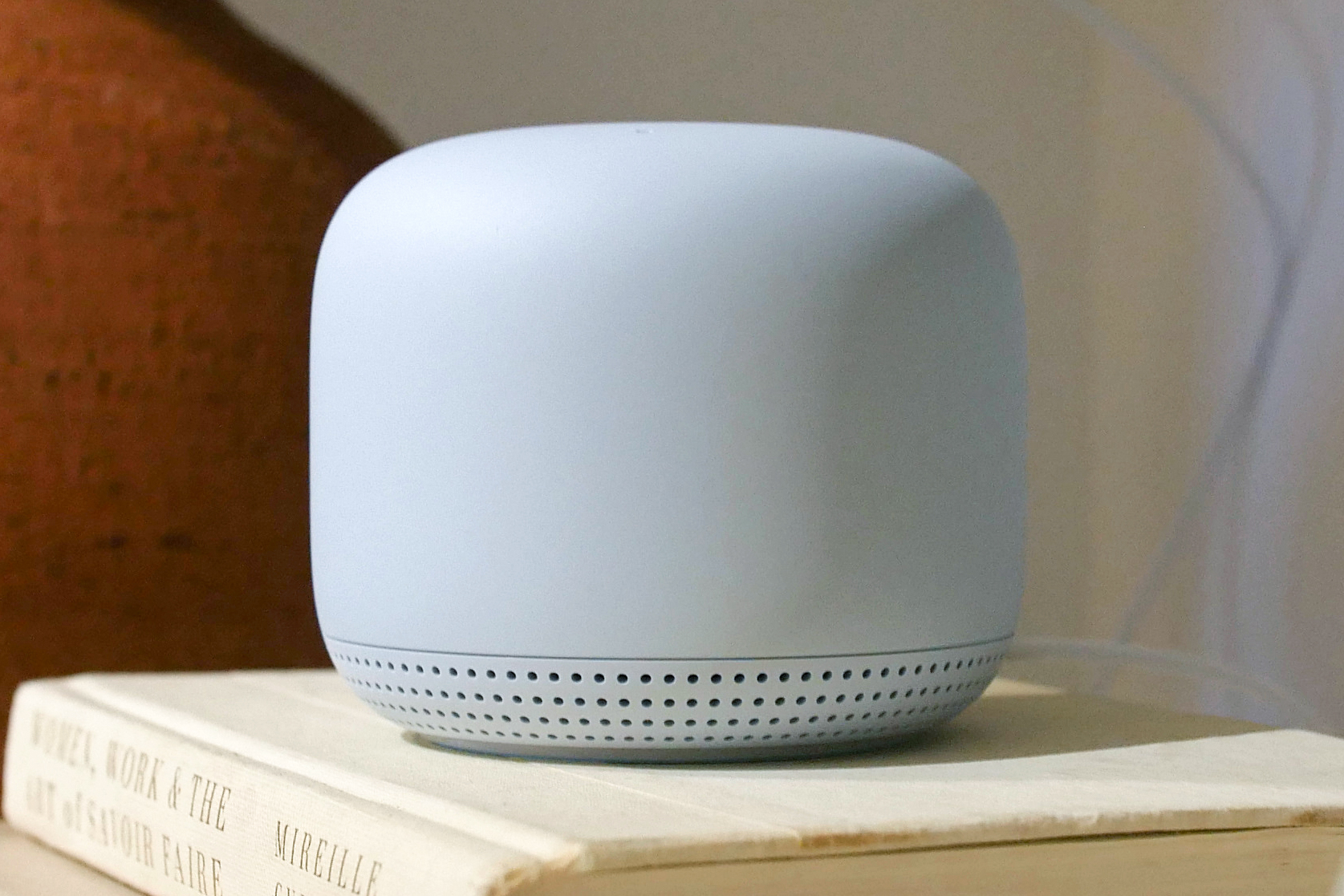 The Google Nest Wifi router on a table.