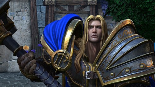 Warcraft 3 Reforged main character holds a hammer and stares at the camera.