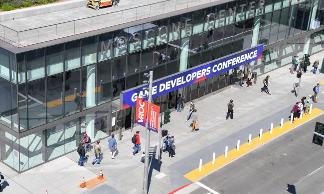 The entrance of a Game Developers Conference seen from above.