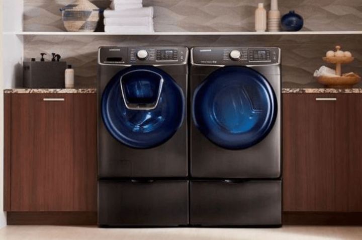 A washer and dryer sit next to each other in the laundry room.