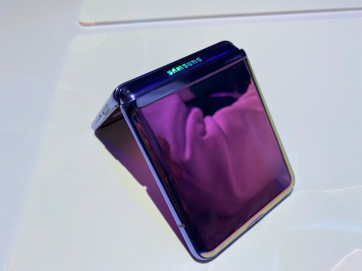 The Galaxy Z Flip face down on a table, half folded.