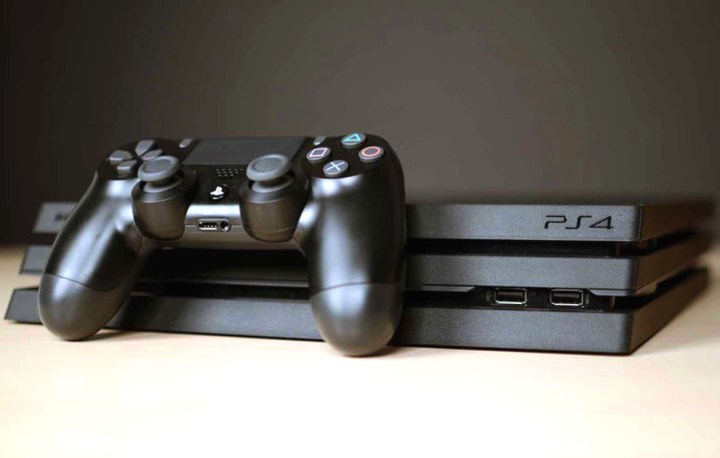 A Sony PlayStation 4 Pro and controller.