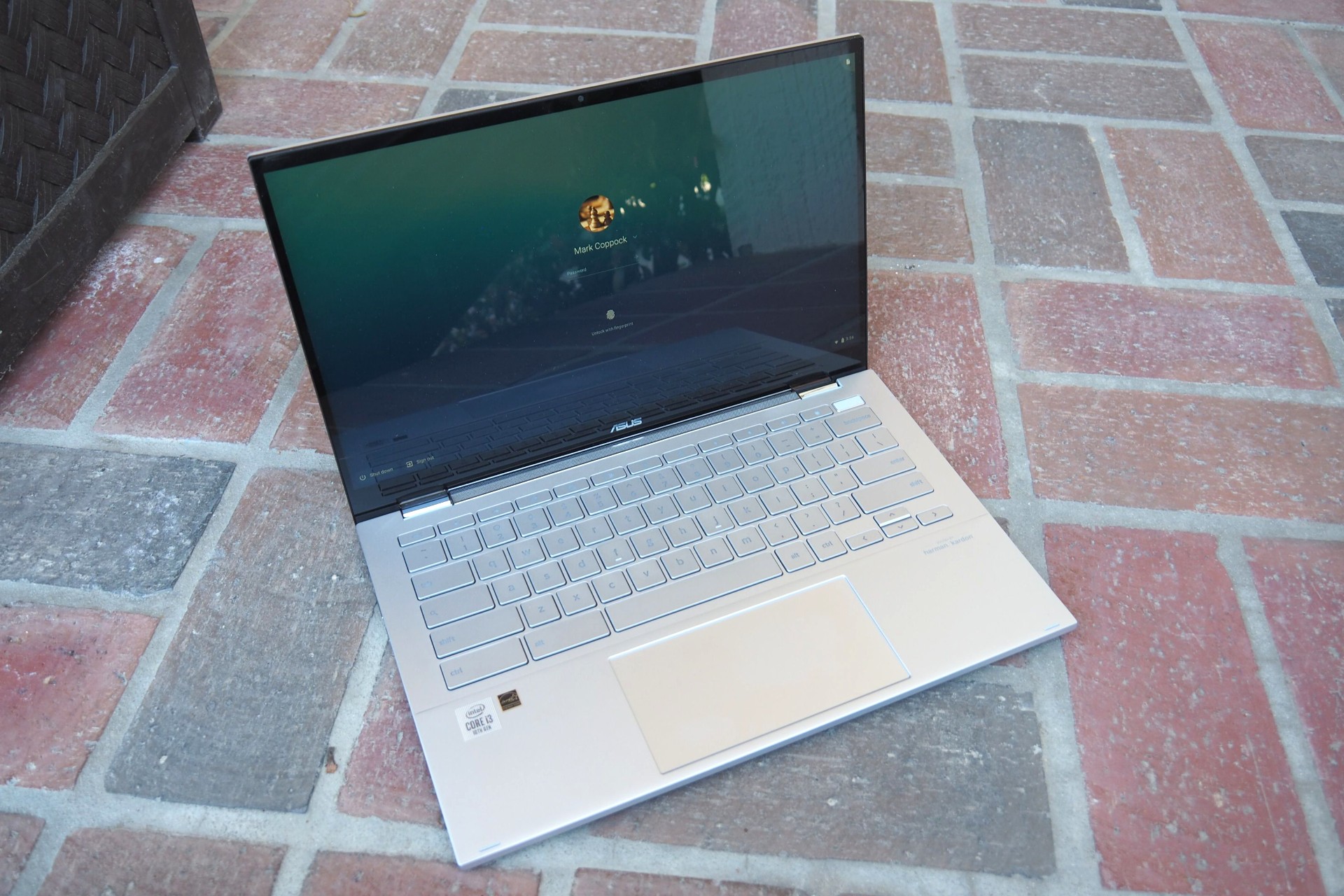 The Asus Chromebook Flip C436 open on a stone patio.