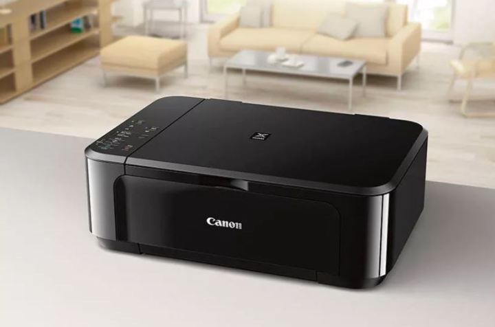 The Canon Pixma MG3620 wireless all-in-one printer on a table.