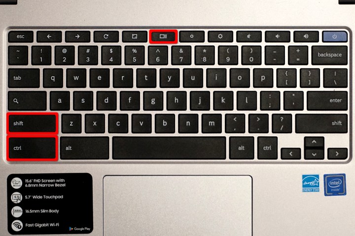 Um teclado do Chromebook com três teclas destacadas em vermelho.