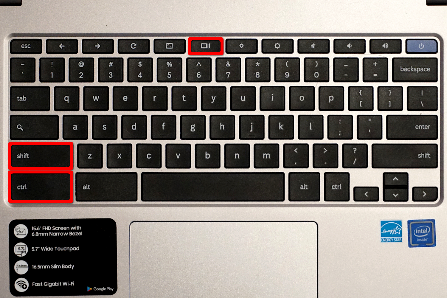 A Chromebook keyboard with three keys highlighted in red.