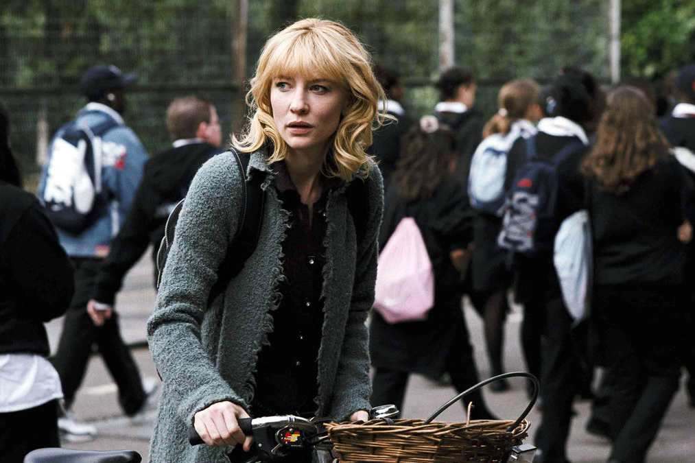 A woman rides a bike in Notes on a Scandal.