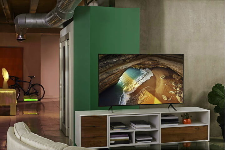 A Samsung 65-inch Class Q70A 4K TV on a media console in a modern loft-style dwelling. 