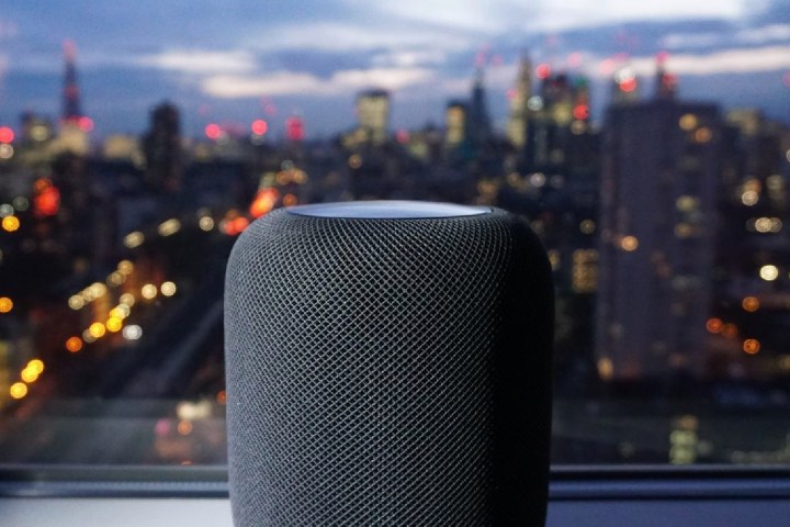 HomePod speaker in window with city view