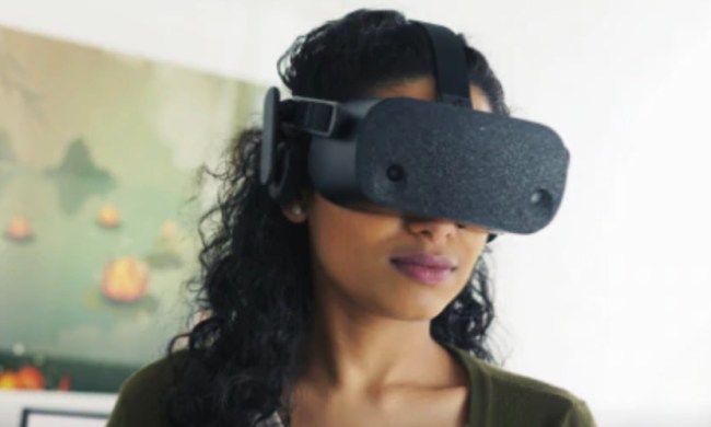 A woman wearing a Valve VR headset.