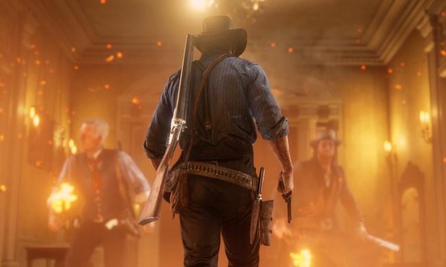 Arthur Morgan walks into a burning house in Red Dead Redemption 2.