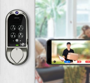 Lockly Vision Smart lock installed on door next to phone showing camera view.