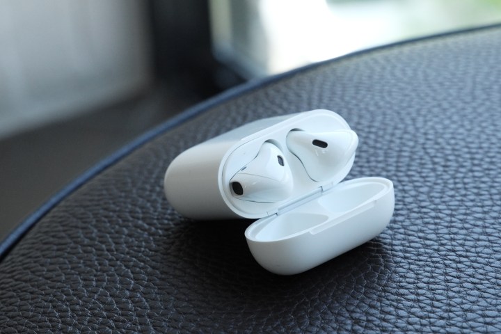 AirPods 2 Charging Case opened connected a table.