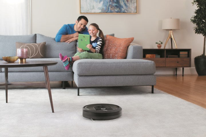 Roomba cleaning a rug.