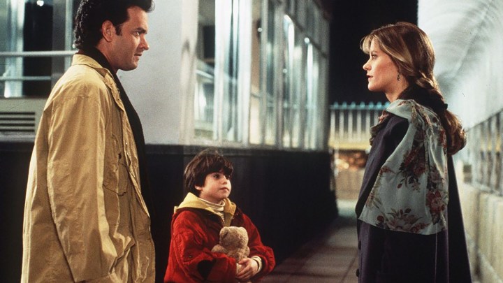 A father and a son talk to a woman in Sleepless in Seattle.