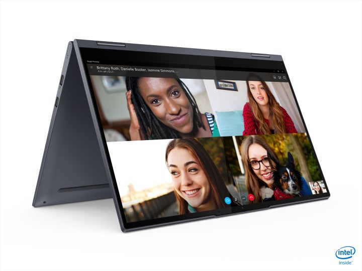 A Yoga 7i sits in tent mode with a video call on the screen.
