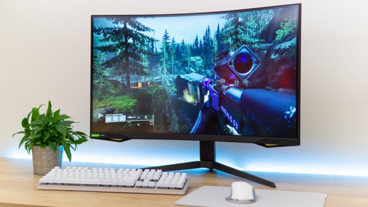 A Samsung Odyssey G7 monitor on a desk.