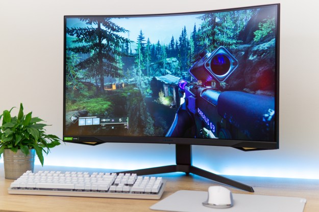 A Samsung Odyssey G7 monitor on a desk.