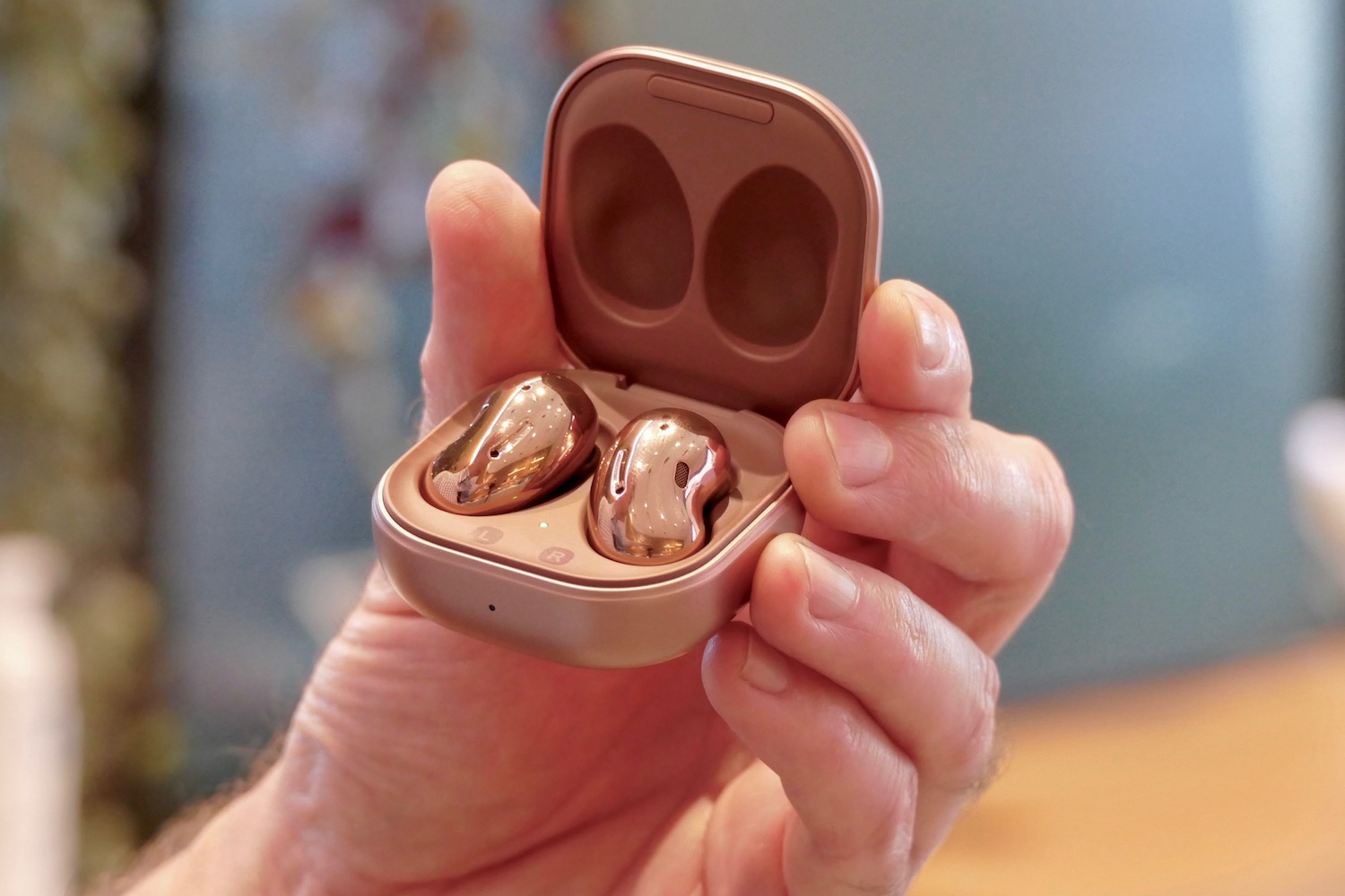 The Samsung Galaxy Buds Live inside their charging case.