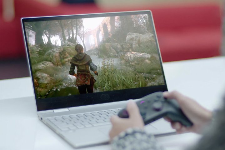 A person plays a game on Amazon Luna on a laptop.