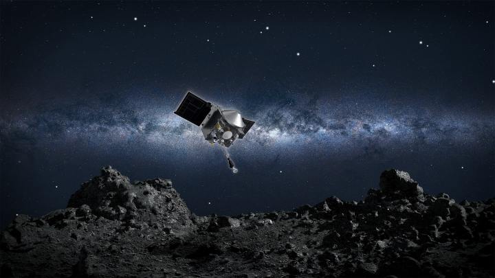 El concepto de este artista muestra la nave espacial OSIRIS-REx de la NASA descendiendo hacia el asteroide Bennu para recolectar una muestra de la superficie del asteroide.