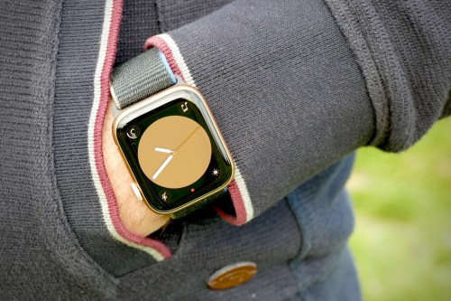 Apple Watch SE being worn on a wrist while the person's hand is in their pocket.