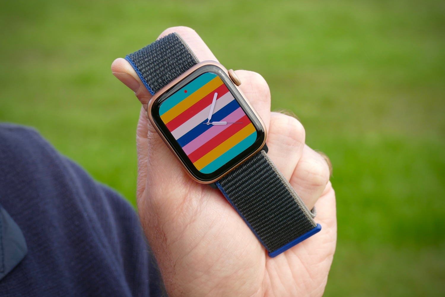 The Stripes face of the Apple Watch SE.