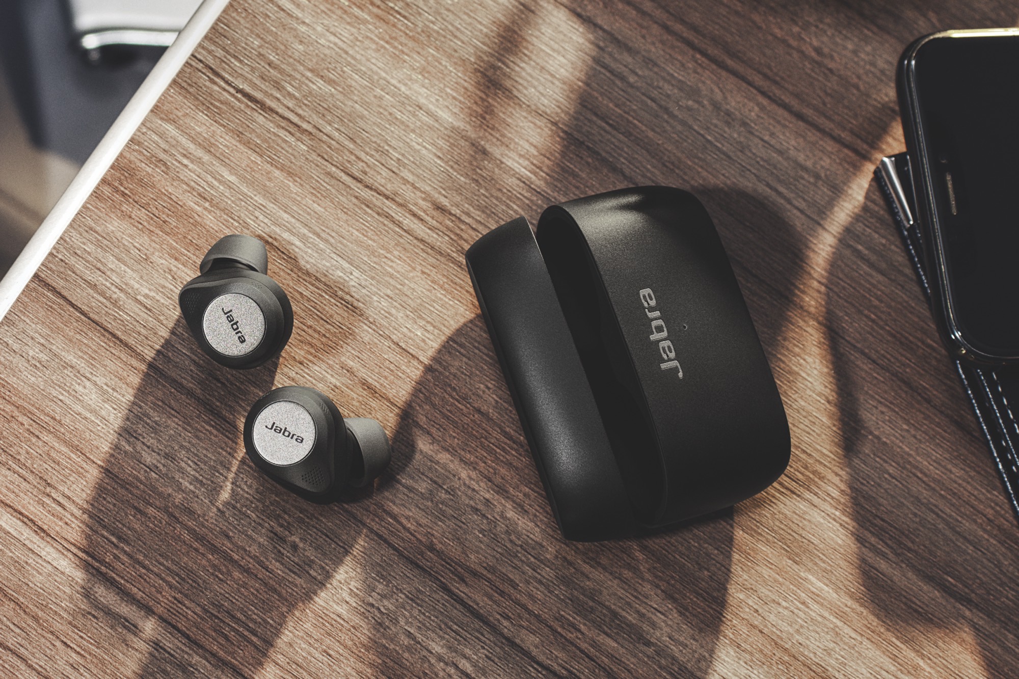 The Jabra Elite 85t wireless earbuds and their charging case.