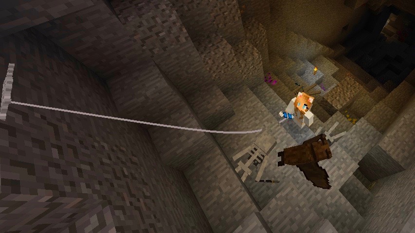 A minecraft character uses a grappling hook to climb out of the underground.