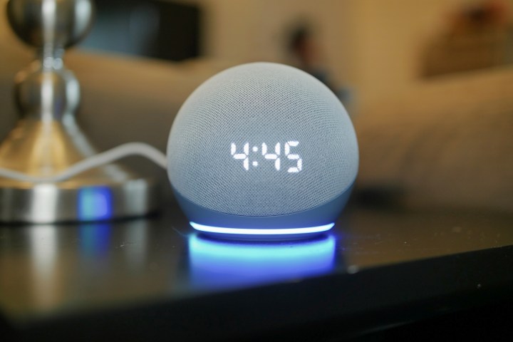 Amazon Echo Dot (4th Gen) with clock displayed.
