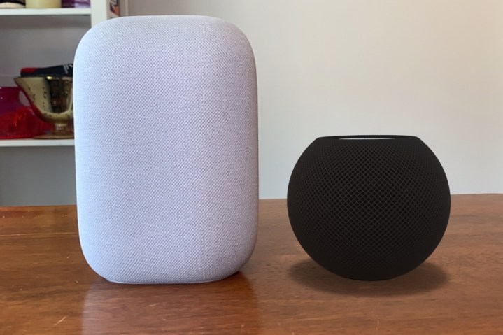 Apple HomePod mini render vs Google Nest Audio on table