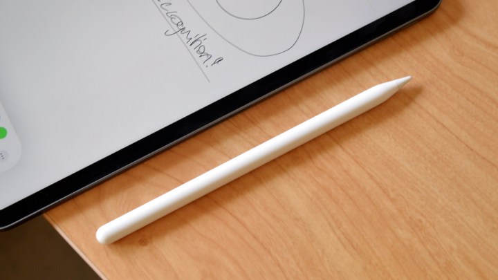 The second-generation Apple Pencil beside an iPad.